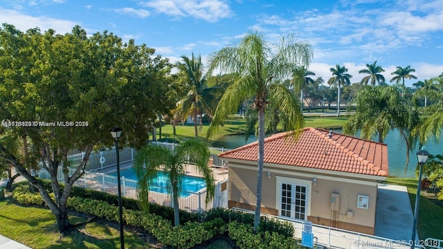 exterior space featuring a water view and french doors