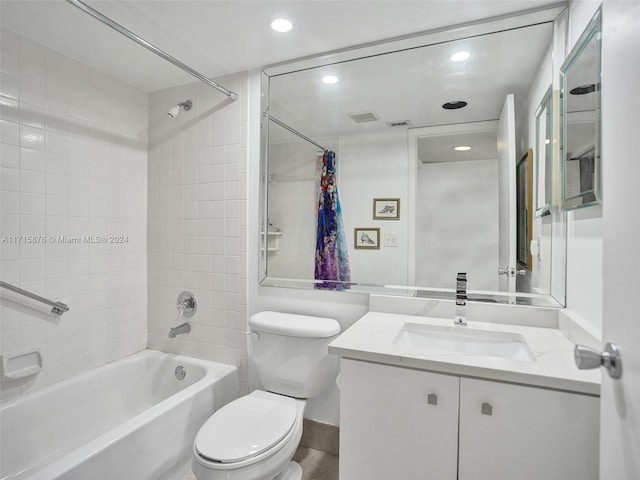 full bathroom featuring vanity, toilet, and shower / bathtub combination with curtain