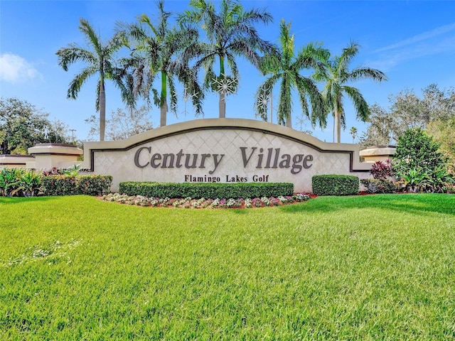 community / neighborhood sign featuring a yard