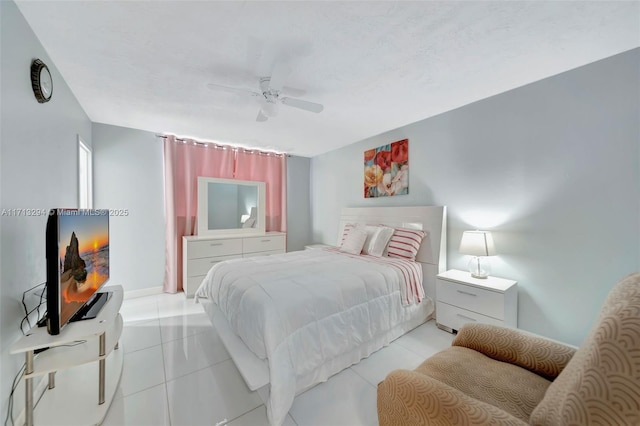 bedroom with ceiling fan and light tile patterned flooring