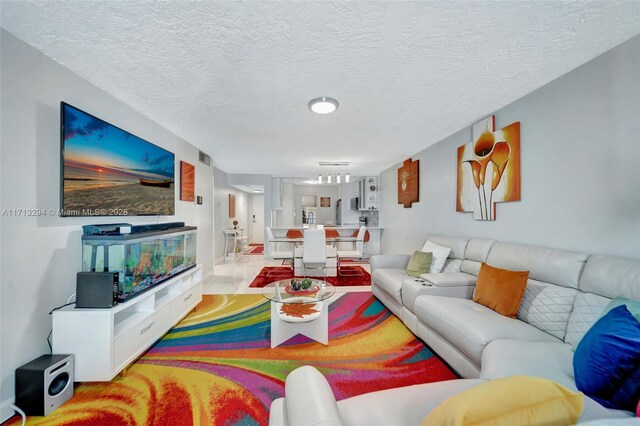 living room with a textured ceiling