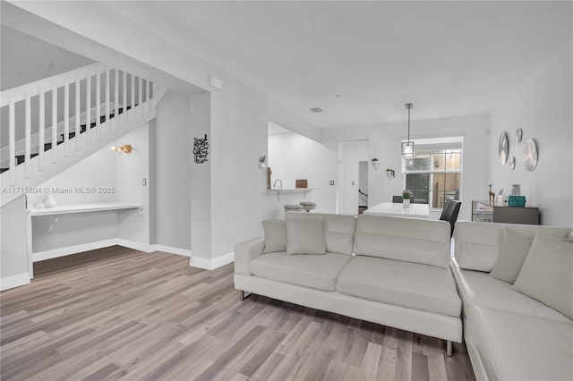 living room with light hardwood / wood-style flooring