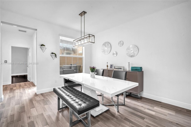 dining room featuring light hardwood / wood-style flooring