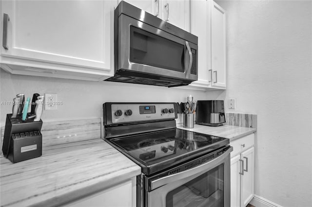 kitchen with white cabinets and stainless steel appliances