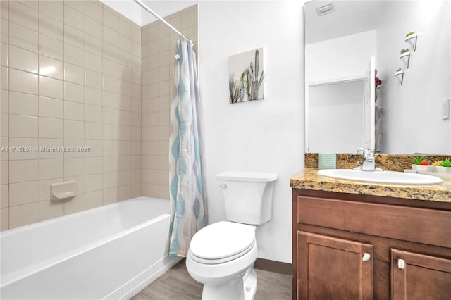 full bathroom with vanity, wood-type flooring, shower / tub combo, and toilet