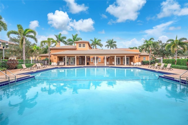 view of swimming pool with a patio area