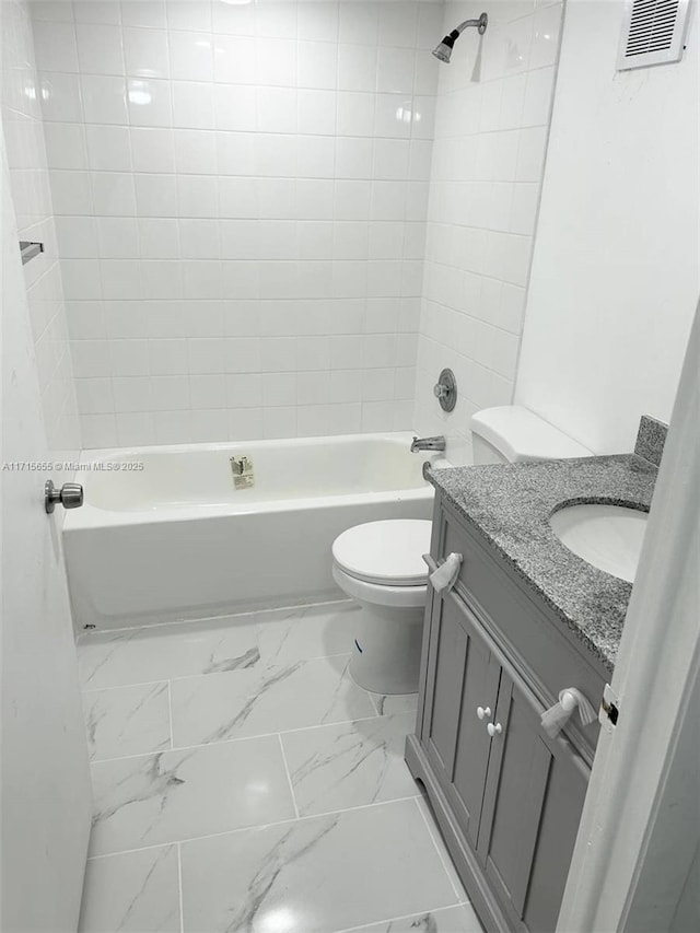 full bathroom with shower / tub combination, vanity, and toilet