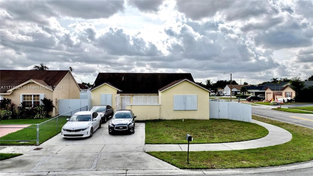 ranch-style house with a front lawn