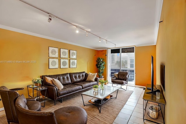 living room featuring light tile patterned floors, rail lighting, floor to ceiling windows, and crown molding