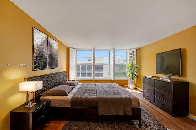 bedroom with hardwood / wood-style floors