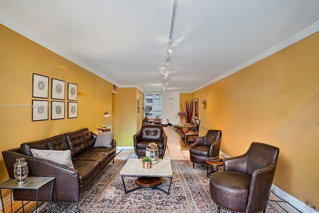 tiled living room featuring crown molding and track lighting