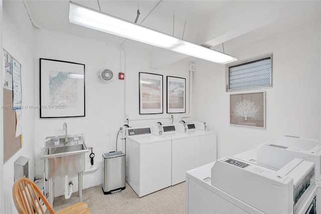 laundry room with washer and clothes dryer and sink