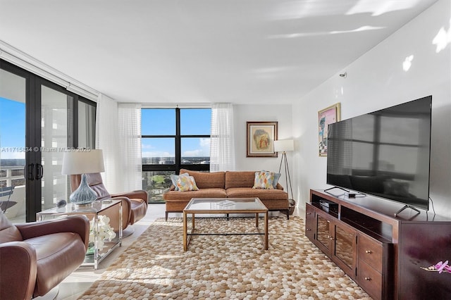 living room featuring floor to ceiling windows