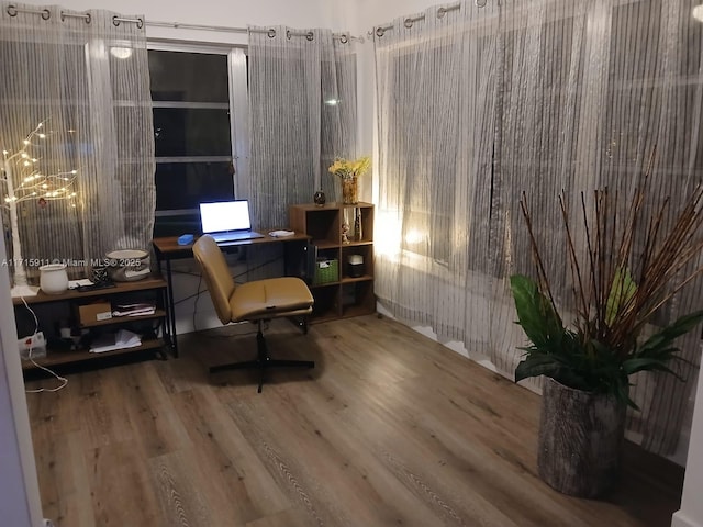 sitting room with hardwood / wood-style flooring