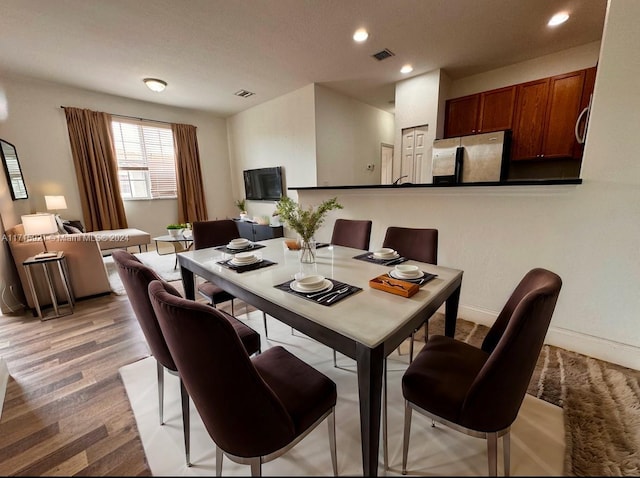 dining area featuring light hardwood / wood-style flooring