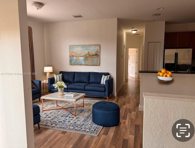 living room featuring dark hardwood / wood-style floors