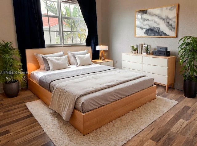 bedroom with light hardwood / wood-style flooring