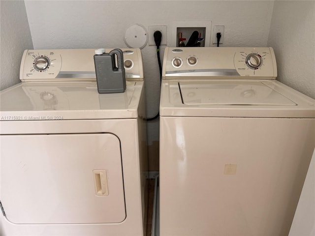 washroom featuring washing machine and dryer