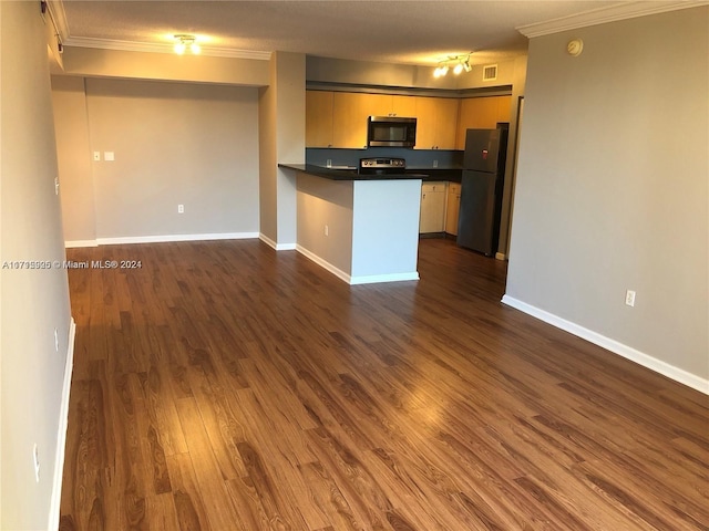 kitchen with dark hardwood / wood-style flooring, kitchen peninsula, ornamental molding, and appliances with stainless steel finishes