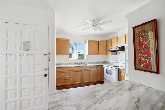 kitchen featuring sink, ceiling fan, and electric stove