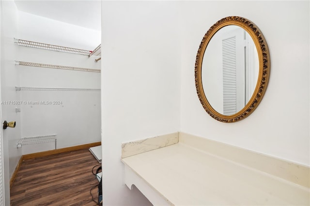 bathroom with hardwood / wood-style flooring