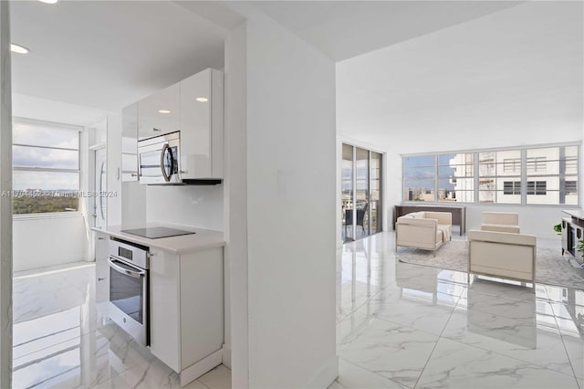 kitchen featuring white cabinetry and stainless steel appliances