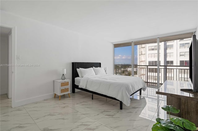 bedroom featuring access to outside and expansive windows