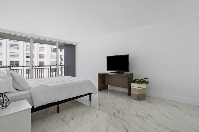 bedroom featuring expansive windows