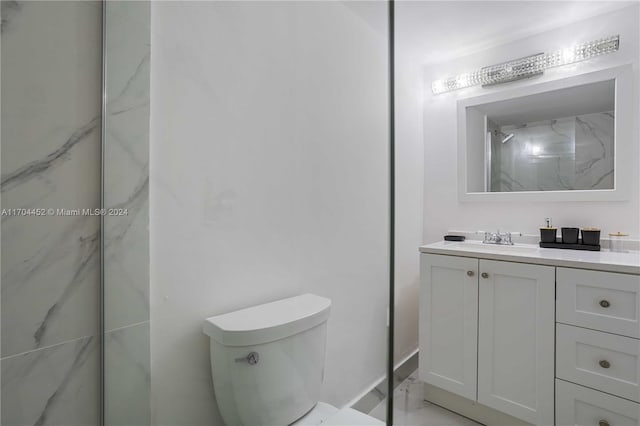 bathroom featuring vanity, toilet, and walk in shower