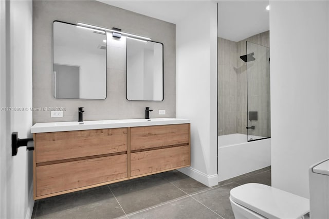 full bathroom with vanity, toilet, and tiled shower / bath