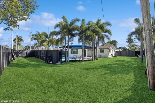 ranch-style house with a carport, a porch, and a front lawn