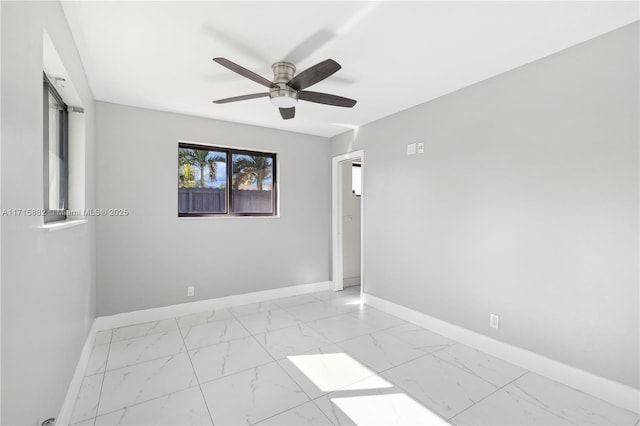 spare room with ceiling fan