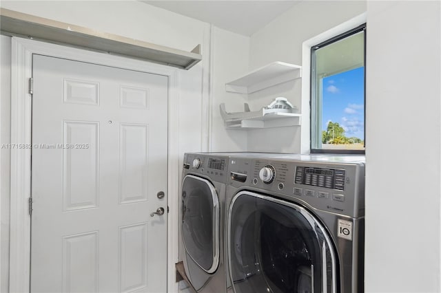 clothes washing area featuring washer and dryer