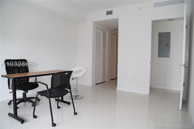 tiled office space with electric panel