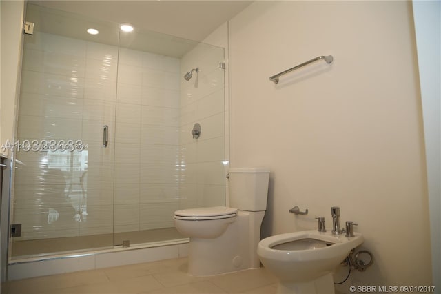 bathroom featuring tile patterned flooring, an enclosed shower, toilet, and a bidet