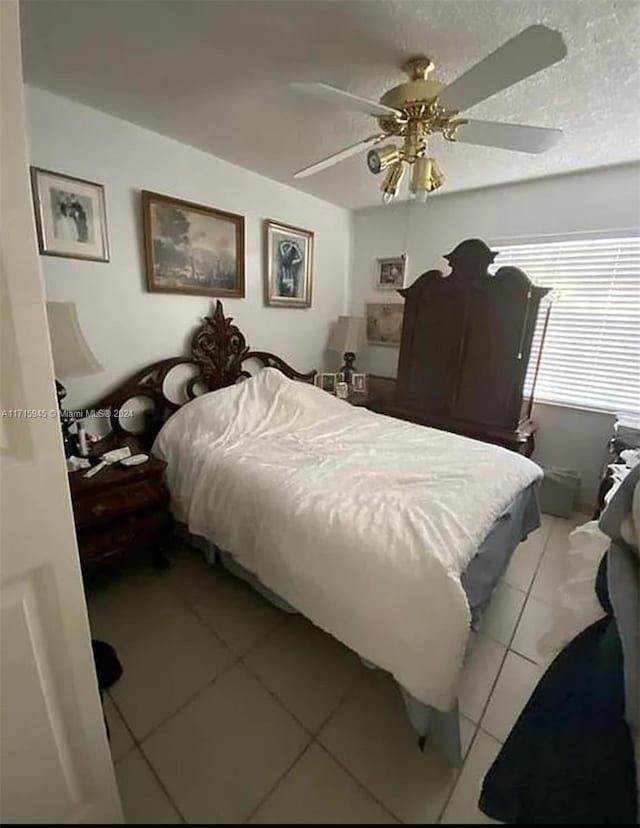 bedroom featuring ceiling fan and light tile patterned flooring