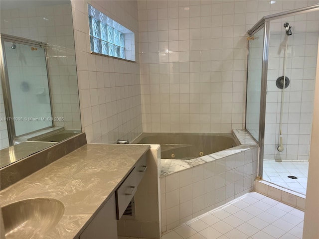 bathroom featuring separate shower and tub, tile patterned flooring, and vanity