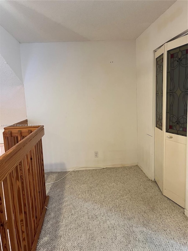 empty room with a textured ceiling