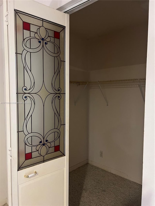 walk in closet featuring tile patterned flooring