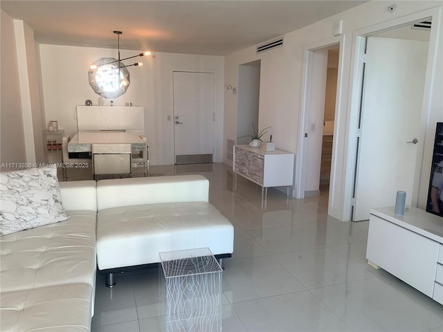 unfurnished bedroom featuring a chandelier