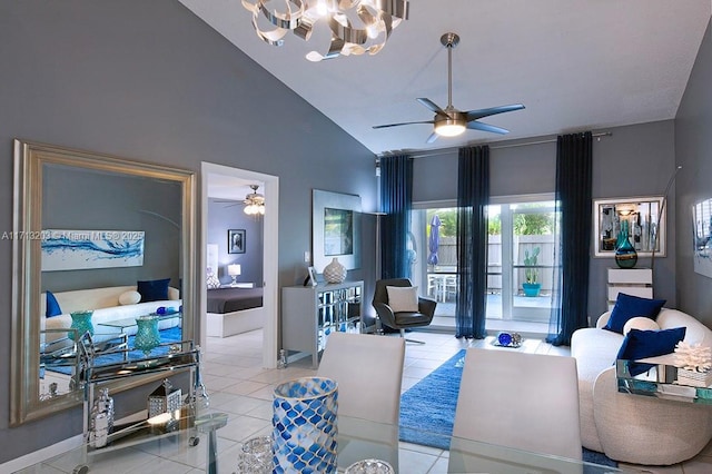 living room with ceiling fan with notable chandelier, lofted ceiling, and light tile patterned floors