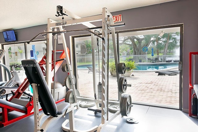 gym featuring a textured ceiling