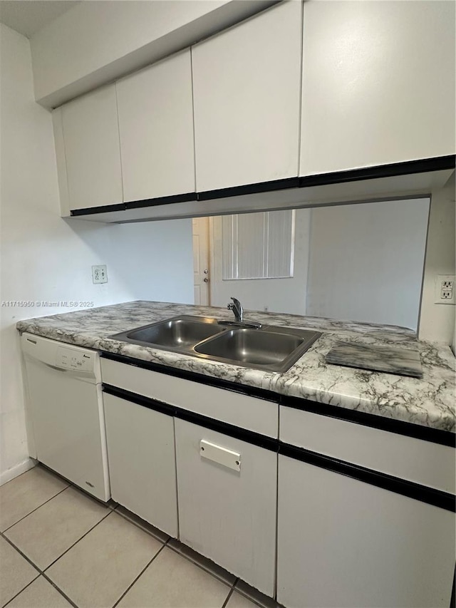 kitchen featuring white cabinetry, dishwasher, light tile patterned flooring, and sink