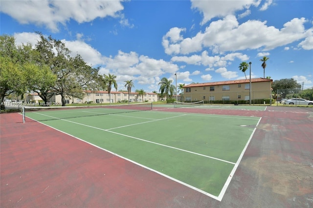 view of sport court featuring basketball hoop