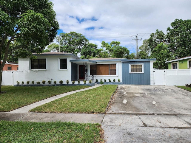 ranch-style house with a front lawn