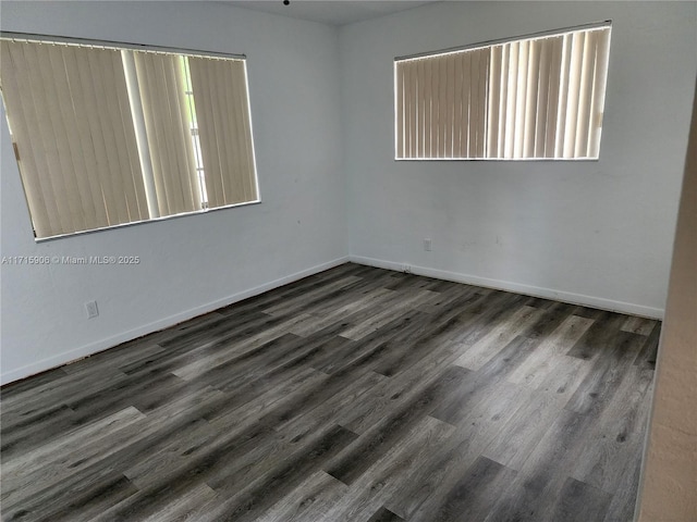 empty room featuring dark hardwood / wood-style floors