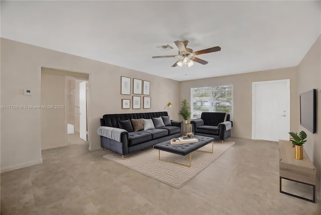 living room featuring light tile patterned flooring and ceiling fan