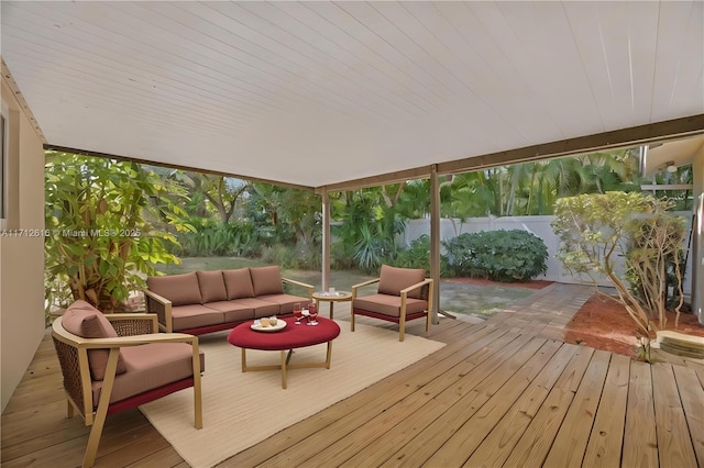 wooden deck with a fenced backyard and an outdoor living space