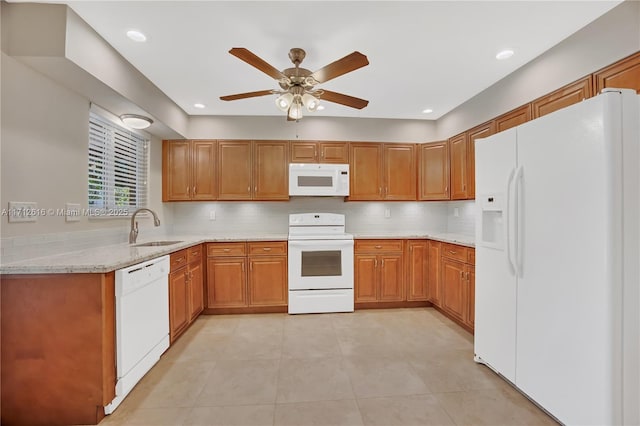 830 SW 18th St, Fort Lauderdale, FL 33315 - kitchen featuring white appliances, a sink, tasteful backsplash, a ceiling fan, and brown cabinetry