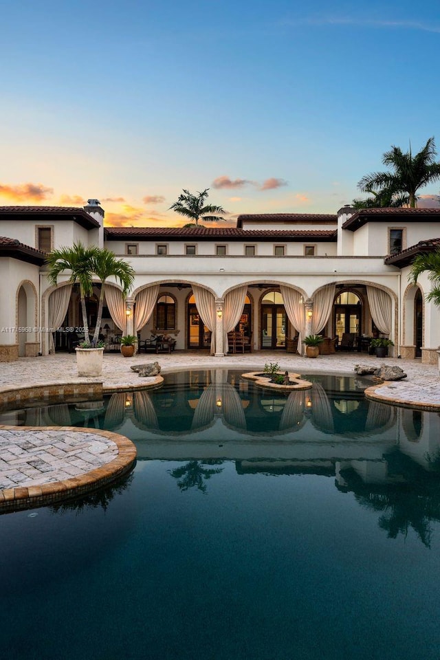 outdoor pool with a patio